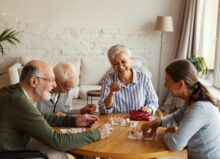 Senior people enjoying bingo game in nursing home