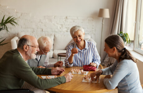 Senior people enjoying bingo game in nursing home