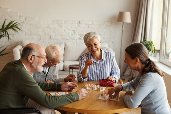 Senior people enjoying bingo game in nursing home