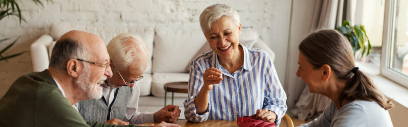 Senior people enjoying bingo game in nursing home