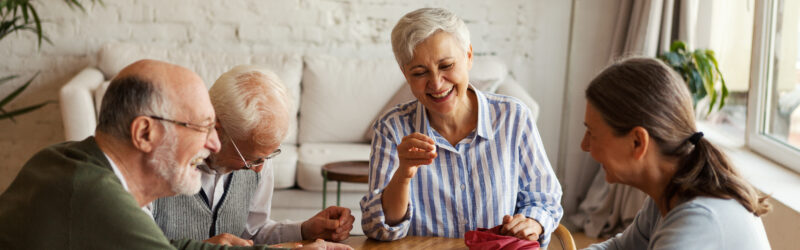 Senior people enjoying bingo game in nursing home